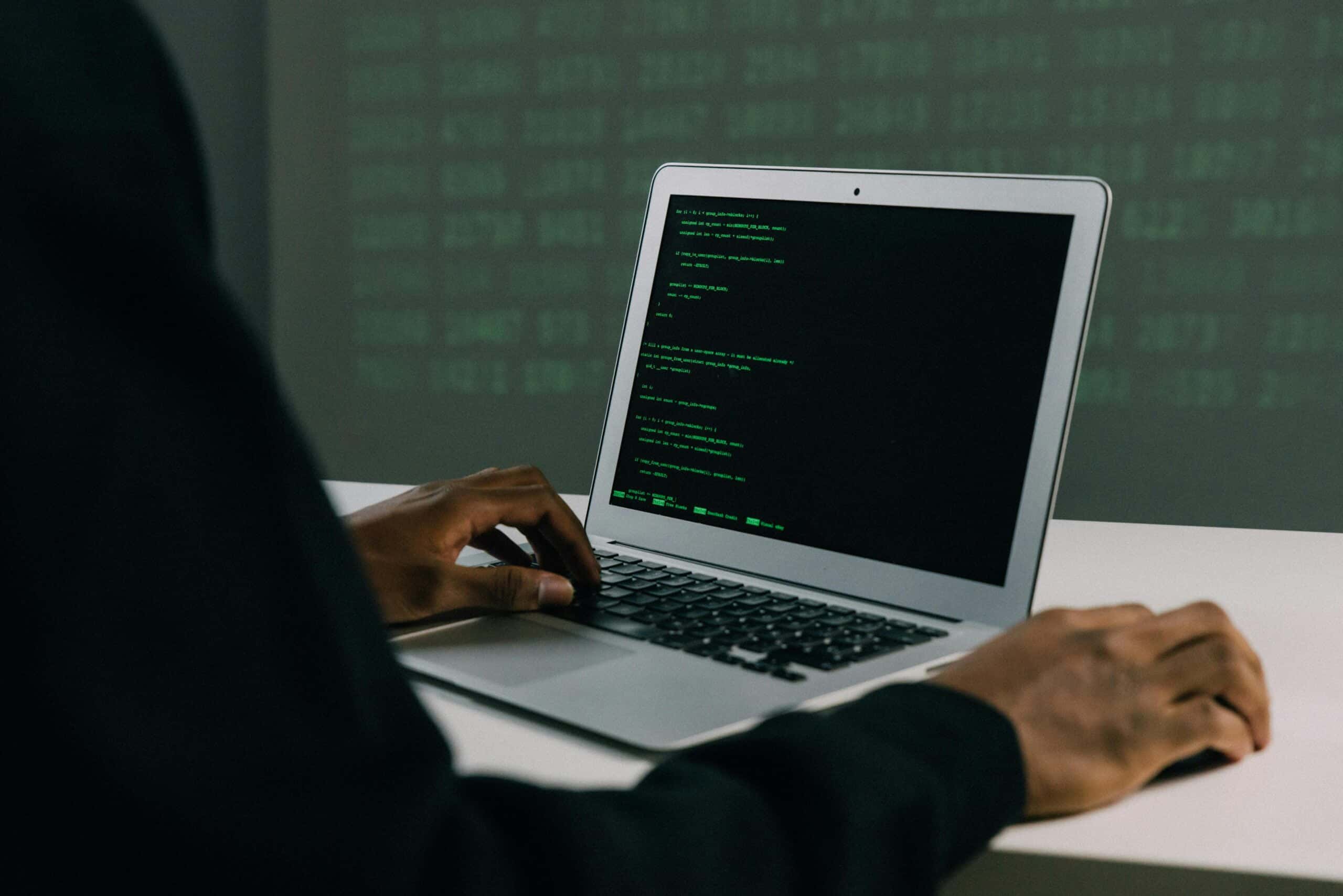 5-Cybersecurity-Predictions-for-2024-You-Should-Plan-For-scaled.jpg Free Person Using Macbook Air Stock Photo